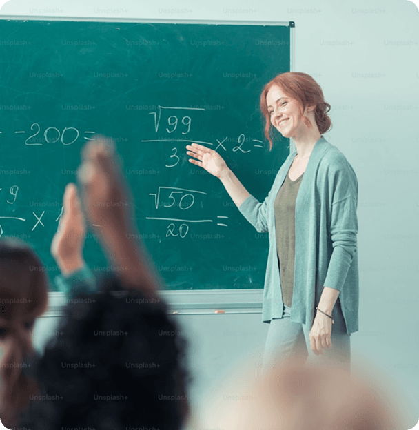 Teacher at blackboard with students